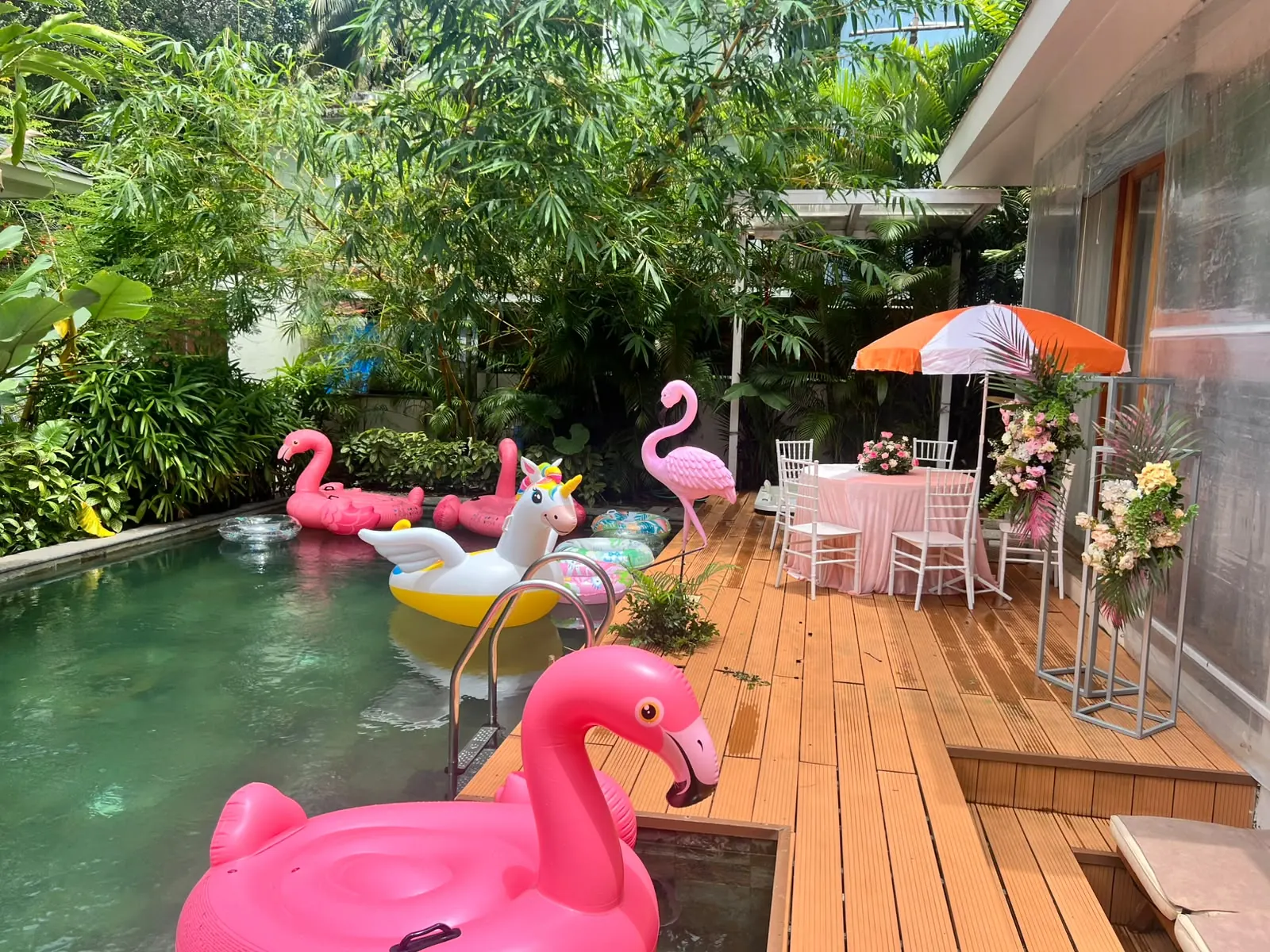 Poolside flamingo floaties with pink cocktail lounge by Imagine Decorators Goa